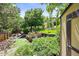 Lush backyard featuring tiered garden beds, mature trees, and a shed at 11072 Zephyr St, Broomfield, CO 80021