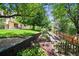 A lush backyard featuring landscaping, mature trees, and a backyard patio at 11072 Zephyr St, Broomfield, CO 80021
