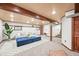 Finished basement with a seating area, wood trim, and plush carpet at 11072 Zephyr St, Broomfield, CO 80021