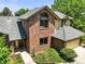 Beautiful two-story brick home featuring a well-manicured lawn, charming walkway, and attached garage at 11072 Zephyr St, Broomfield, CO 80021
