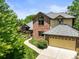 Charming two-story home with a brick exterior, attached garage, and well-manicured lawn at 11072 Zephyr St, Broomfield, CO 80021