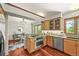 Well-equipped kitchen with stainless steel appliances, wood cabinets, and open access to the dining area at 11072 Zephyr St, Broomfield, CO 80021