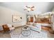 Inviting living room with a stylish rug, modern sofa, chair, and contemporary art at 11072 Zephyr St, Broomfield, CO 80021