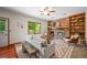 Cozy living room with brick fireplace, built-in bookshelves, and comfortable seating at 11072 Zephyr St, Broomfield, CO 80021