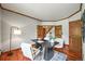 Stylish office space with hardwood floors, wood trim, and a view of the entryway at 11072 Zephyr St, Broomfield, CO 80021