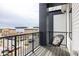 Relaxing balcony space with modern seating and scenic neighborhood view at 8280 E 36Th Ave # 27, Denver, CO 80238