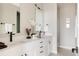 Modern bathroom featuring double sinks, sleek fixtures, and neutral color palette at 8280 E 36Th Ave # 27, Denver, CO 80238