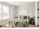This bright bedroom features modern furniture and decor at 8280 E 36Th Ave # 27, Denver, CO 80238