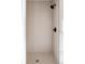 Tiled walk-in shower featuring sleek black fixtures and neutral tile at 8280 E 36Th Ave # 27, Denver, CO 80238