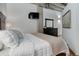 Well-lit bedroom featuring a comfortable bed, dresser, and modern decor at 1020 15Th St # 210, Denver, CO 80202