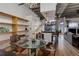 Dining area featuring exposed duct work and modern chandelier at 1020 15Th St # 210, Denver, CO 80202