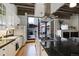 Bright kitchen featuring granite countertops, stainless steel appliances, and access to an outdoor patio at 1020 15Th St # 210, Denver, CO 80202