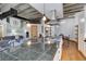 Contemporary living room featuring an island with cooktop, an open layout, and exposed ductwork at 1020 15Th St # 210, Denver, CO 80202