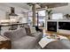 Living room with gray sofa, a kitchen view and a fireplace at 1020 15Th St # 210, Denver, CO 80202