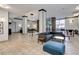 Spacious lobby area with cozy seating, modern lighting, and attractive tile flooring at 1020 15Th St # 210, Denver, CO 80202