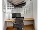 Bright home office area with wood floors, a glass block window, and a comfortable desk setup at 1020 15Th St # 210, Denver, CO 80202