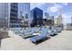 Inviting rooftop deck with stylish lounge chairs and city views at 1020 15Th St # 210, Denver, CO 80202