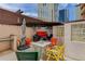 Cozy rooftop patio with colorful seating, string lights, and views of city buildings at 1020 15Th St # 210, Denver, CO 80202