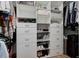 Organized walk-in closet featuring built-in shelving and drawers for optimal storage at 1020 15Th St # 210, Denver, CO 80202