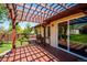 Backyard deck with pergola shading sliding glass doors at 13895 W Atlantic Ave, Lakewood, CO 80228