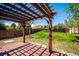 Lovely backyard featuring a charming pergola and lush green lawn at 13895 W Atlantic Ave, Lakewood, CO 80228