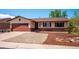 Charming single-story home with a well-maintained front yard and a two-car garage for added convenience at 13895 W Atlantic Ave, Lakewood, CO 80228
