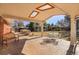 Relaxing covered patio with textured concrete, skylights, and an outdoor dining set at 7420 Quaker St, Arvada, CO 80007