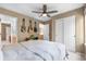 Relaxing bedroom featuring neutral walls, ceiling fan, and a trio of guitars displayed for a musical touch at 10262 Spotted Owl Ave, Highlands Ranch, CO 80129