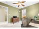 Functional home office space with natural light and view into adjoining bathroom at 10262 Spotted Owl Ave, Highlands Ranch, CO 80129