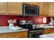 Kitchen with stainless steel oven, maple cabinets and white counter tops at 10262 Spotted Owl Ave, Highlands Ranch, CO 80129