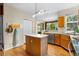 Kitchen featuring a center island, stainless steel appliances, and hardwood floors at 10262 Spotted Owl Ave, Highlands Ranch, CO 80129