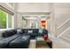 Spacious living room featuring a large sectional sofa, and stairs leading to the second floor at 10262 Spotted Owl Ave, Highlands Ranch, CO 80129