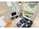 Open-concept living room with high ceilings, fireplace, and great natural light at 10262 Spotted Owl Ave, Highlands Ranch, CO 80129