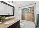 Neutral bathroom features a shower-tub combination, granite countertops, and an updated vanity at 9189 Fallen Rock Rd, Conifer, CO 80433
