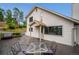 Side view of a home with a large deck and outdoor seating area at 9189 Fallen Rock Rd, Conifer, CO 80433