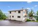 Exterior view of home with front yard, lush trees and greenery at 9189 Fallen Rock Rd, Conifer, CO 80433