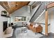 Comfortable living room showcasing modern furnishings, fireplace, and high ceilings at 9189 Fallen Rock Rd, Conifer, CO 80433