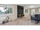 Playful living area with mounted television, comfortable sofa and bright natural light at 9189 Fallen Rock Rd, Conifer, CO 80433