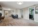 Bright living room features new paint, carpet, furniture, and an open view of the home at 9189 Fallen Rock Rd, Conifer, CO 80433