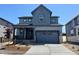 Charming two-story home with a covered porch, two-car garage and a modern design at 11016 Snowdon St, Parker, CO 80134