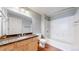 Well-lit bathroom featuring modern vanity, toilet, and a clean bathtub with a shower, perfect for relaxation at 444 17Th St # 301, Denver, CO 80202