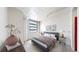 Serene bedroom showcasing a comfortable bed, city views from large windows, and stylish decor at 444 17Th St # 301, Denver, CO 80202