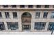 Classic building entrance of Midland Lofts, featuring an arched doorway and vintage-style lighting at 444 17Th St # 301, Denver, CO 80202