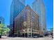 Classic brick building nestled in the city center surrounded by modern buildings and vibrant street life at 444 17Th St # 301, Denver, CO 80202