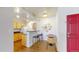 Modern kitchen with a breakfast bar, sleek countertops, and ample cabinet space next to a cozy dining area at 444 17Th St # 301, Denver, CO 80202
