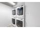 Efficient laundry area features stacked washer and dryer, maximizing space in this modern home at 444 17Th St # 301, Denver, CO 80202