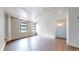 Spacious room with big windows and hardwood floors, offering natural light and plenty of room to relax at 444 17Th St # 301, Denver, CO 80202