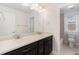 Modern bathroom features a double sink vanity and a separate toilet room at 3266 Yale Dr, Broomfield, CO 80023