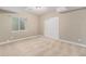 Clean bedroom with neutral paint, carpet, window, and a closet at 3266 Yale Dr, Broomfield, CO 80023