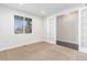 Bright home office with natural light, neutral carpet, and a glass french door entrance at 3266 Yale Dr, Broomfield, CO 80023